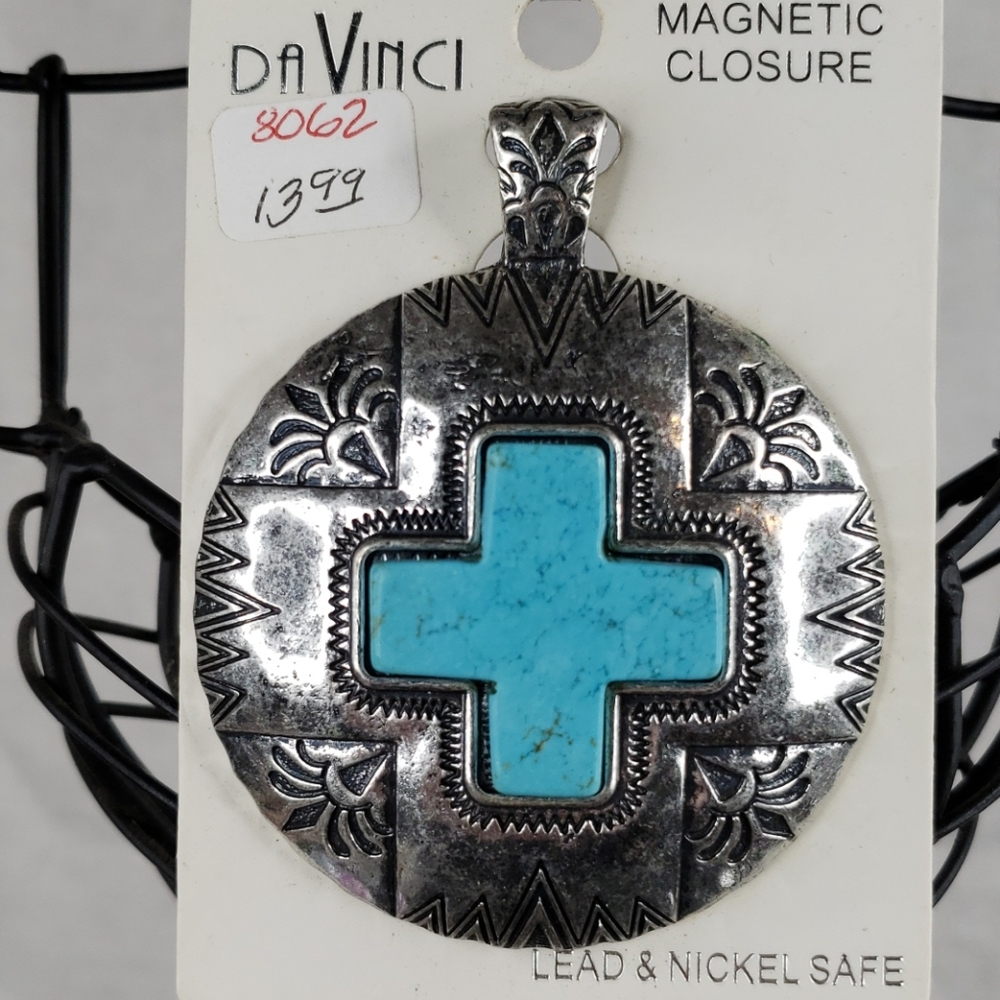 Cross medallion.    E12